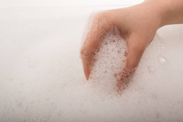 istock Child washing hands  in foam 646970820