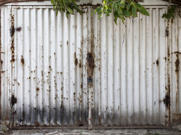 istock old metal warehouse door 646971788