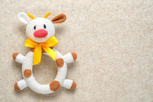 istock amigurumi toy cow on a knitted background with copy space 646977800