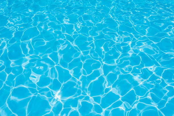 istock Blue and bright ripple water and surface in swimming pool 646977878