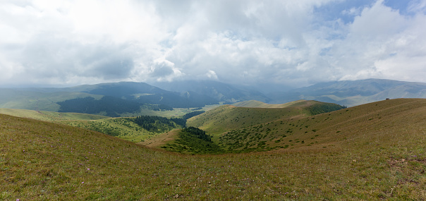 Steppe Kazakhstan, Trans-Ili Alatau, plateau Assy, a road is in mountains