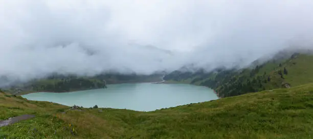 Photo of Thick white mist over the Big Almaty Lake