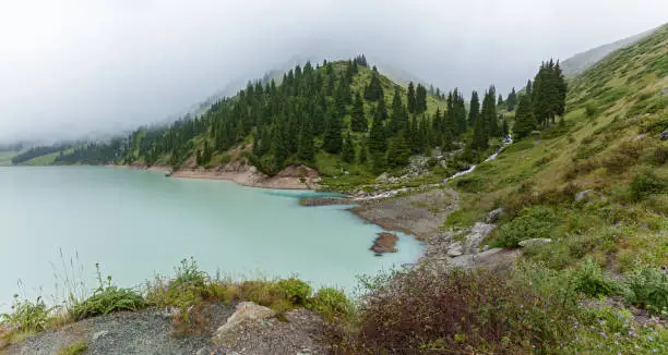 Photo of Thick white mist over the Big Almaty Lake