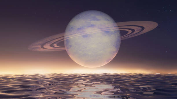 istock The planet Saturn rising over a night sea 646981764
