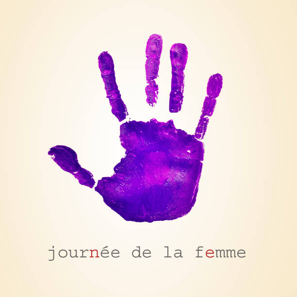 a violet handprint and the text journee de la femme, womens day in french, on a beige background
