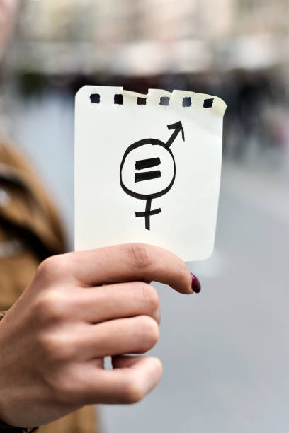 istock woman with a symbol for gender equality 646982670