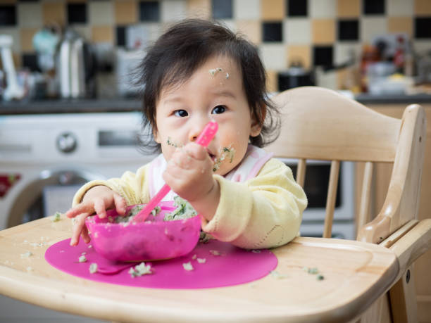 istock eating mess baby girl 646989662