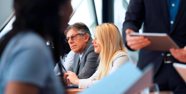 istock Group of business people at meeting 646996864