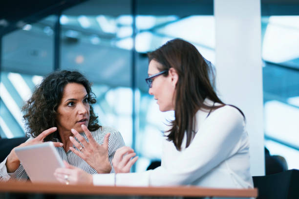 istock Businesswomen at meeting 646997668