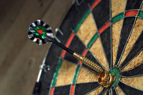 istock wedding rings and darts arrow 647001046