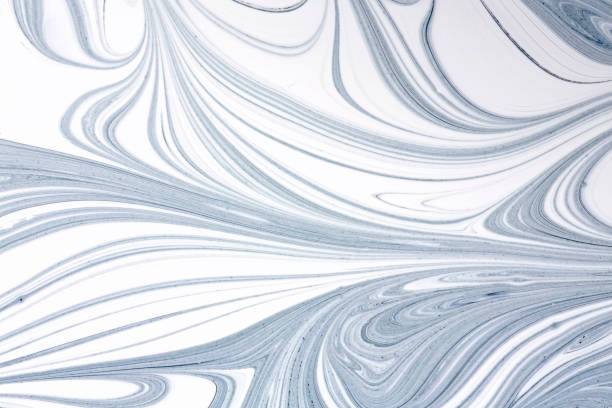 istock Mix of a white and black paint, closeup. 647001418