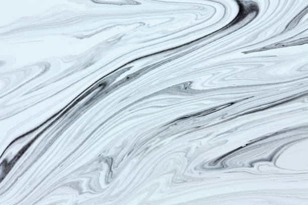 istock Mix of a white and black paint, closeup. 647004520
