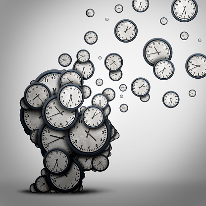 Planning time business concept or wasting minutes as a group of timepieces or clocks shaped as a human head as a health symbol for psychology or scheduling pressure and dementia or loss and aging as a 3D illustration.