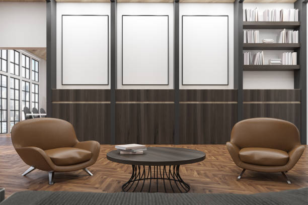 istock Office waiting room with books and armchairs 647006196