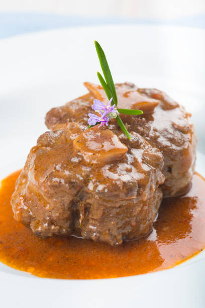 istock Oxtail stew decorated with rosemary flowers 647008798