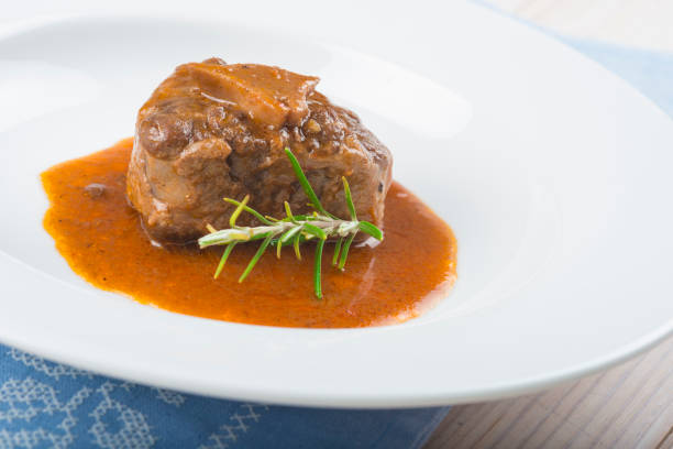 istock Oxtail stew decorated with rosemary flowers 647009196