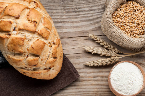 istock loaf of bread on wooden table 647012284