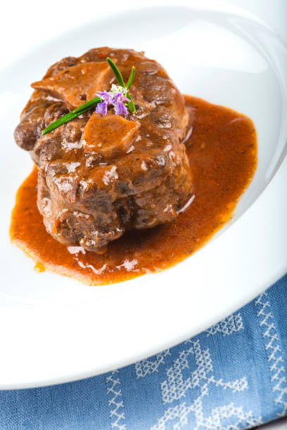 istock Oxtail stew decorated with rosemary flowers 647012402