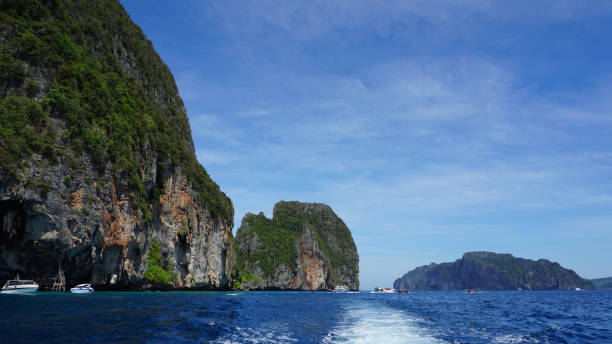 istock Speed boat, Rocky mountain, Blue sky 647018160