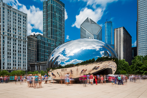 Chicago, Illinois, USA - July 3, 2014: Tourists around the Cloud Gate (\
