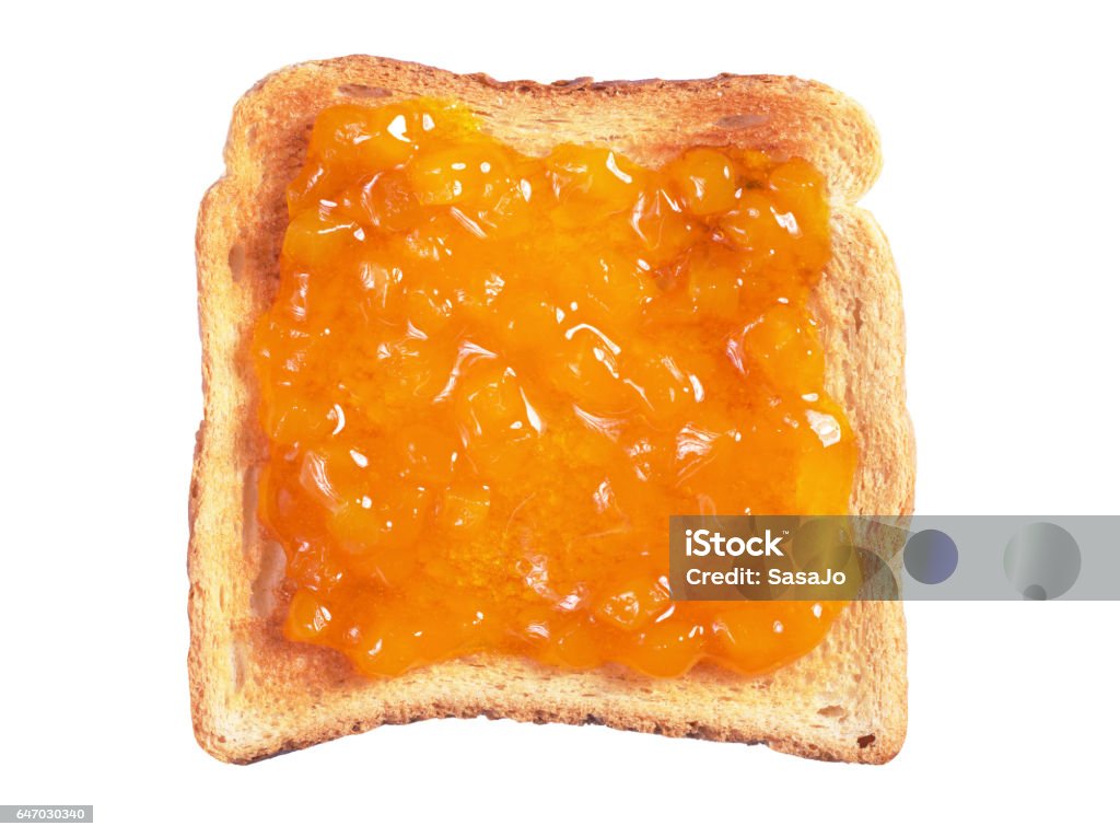 Toasted bread with jam Slice of toasted bread with apricot jam isolated on a white background Marmalade Stock Photo