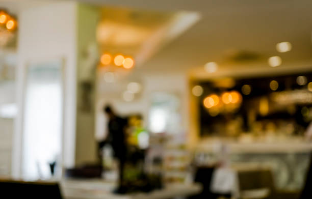 istock Cafe bar interior with lamps defocused background 647036108