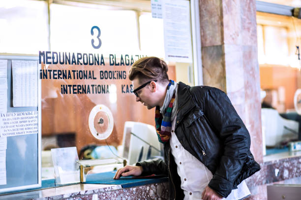 istock Business man buying a ticket for transport 647047272
