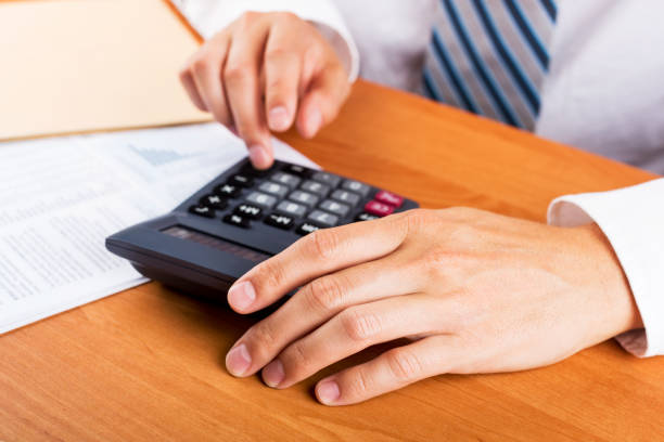 istock Man doing his accounting, financial adviser working 647053914