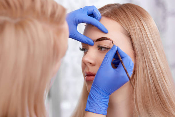 istock Permanent makeup of eyebrows for blonde woman 647057242