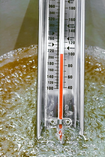 View of a thermometer as it reaches boiling point.