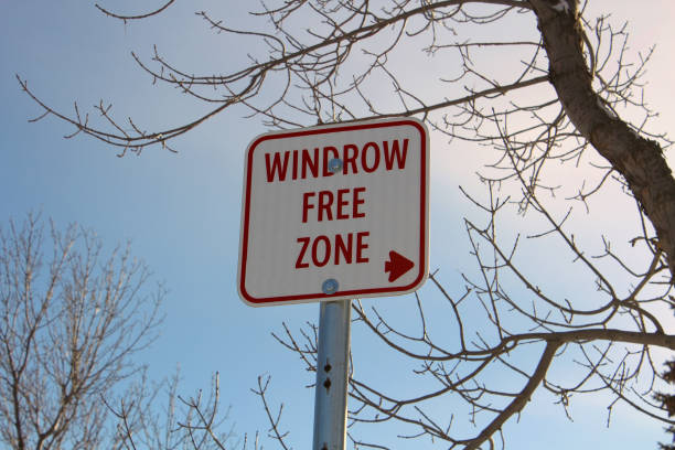 istock Windrow Free Zone Sign Against Blue Sky 647068448