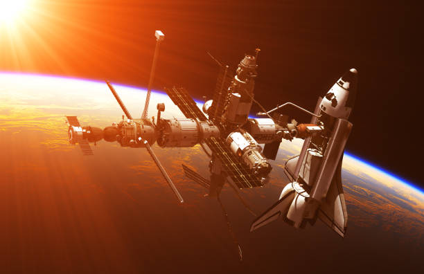 istock Space Shuttle And Space Station In The Rays Of Sun 647072074