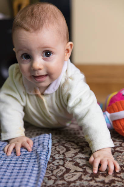 istock Baby girl playing 647080836