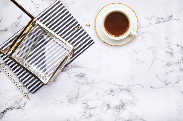 istock Woman desktop elegant. Flat lay. Gold items on the table. Marble mock-up background. Header or hero website. mock up for artwork .View from above 647081160