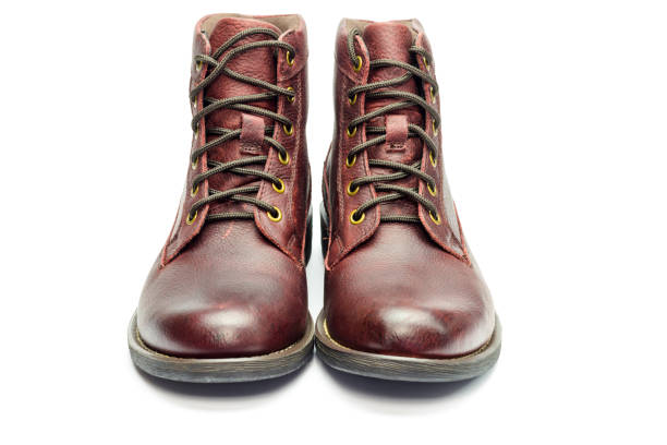 istock Stylish brown leather boots for men isolated on white background. 647083690