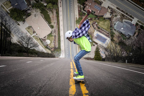 Long boarding down super steep hill Long boarding down unreal super steep hill steep stock pictures, royalty-free photos & images