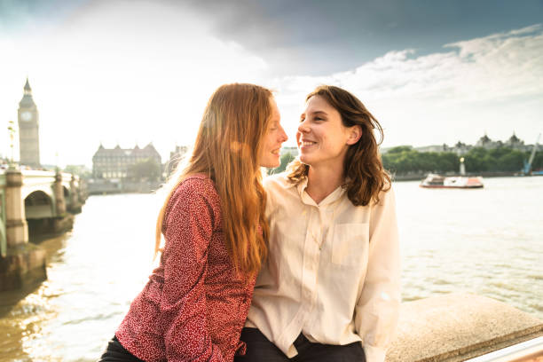 istock lesbian couple kissing at dusk 647096190