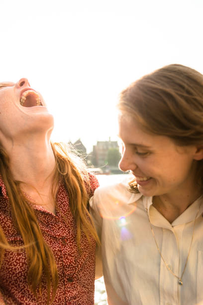istock lesbian couple kissing at dusk 647096242