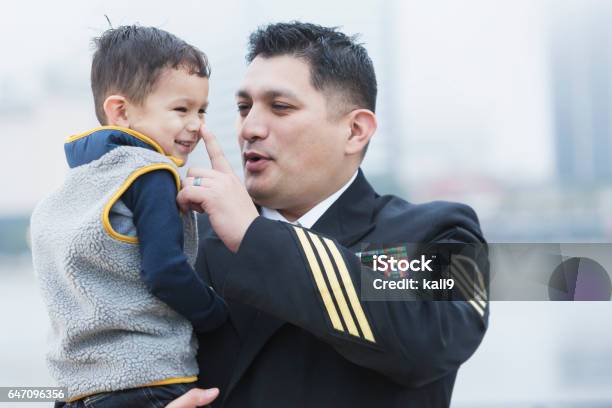 Hispanic Military Man Holding 2 Year Old Son Stock Photo - Download Image Now - Navy, Family, Military