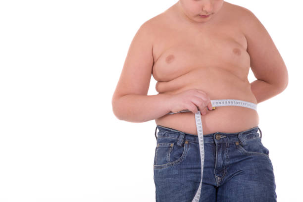 istock Fat boy measuring his belly 647096370