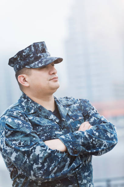 istock Hispanic man wearing military uniform 647096636