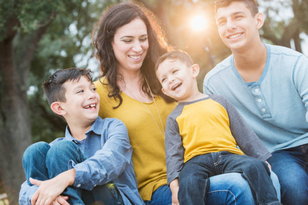 istock Hispanic mother with her three boys 647099306
