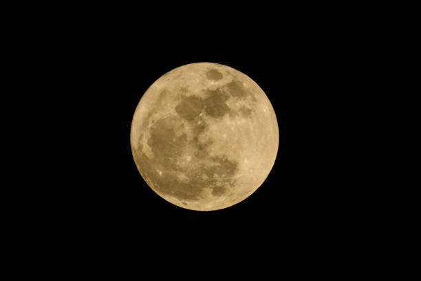 istock Full moon over dark black sky at night from Thailand 647102878