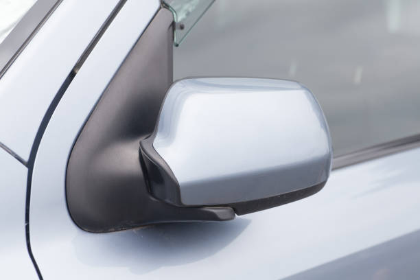 istock Side rear-view mirror closed for safety at car park. 647106652