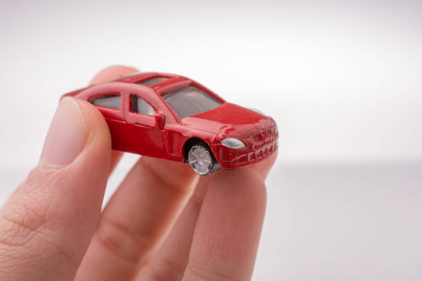 istock Colorful little toy car in hand 647113946