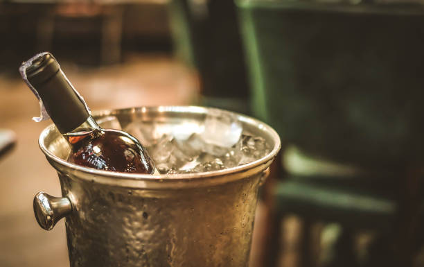 istock red wine bottle and on ice bucket 647123454