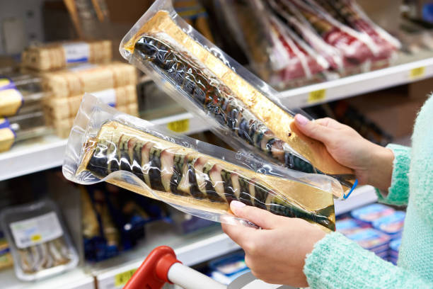 istock Buyer chooses smoked fish mackerel 647126150