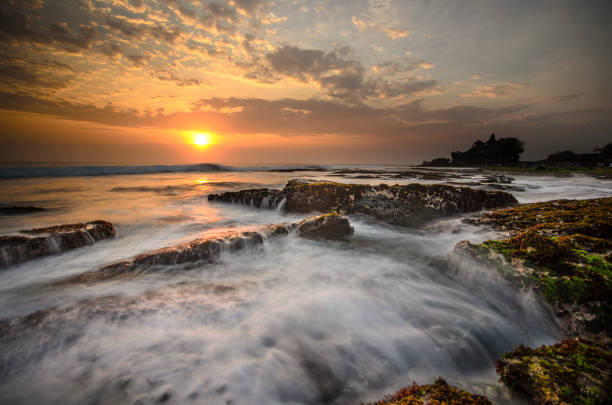 istock tanah lot on sunset 647127116