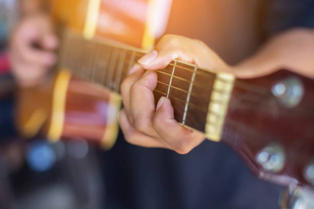 istock Close up man's hand playing the guitar. 647127258