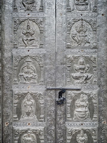 Old beautiful decorated door made of silver with different Gods in Sri Vadapathira Kaliamman temple Singapore